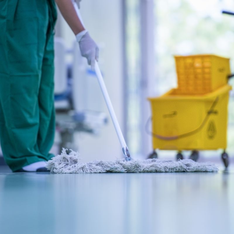 Healthcare cleaning professionals sanitizing a medical clinic